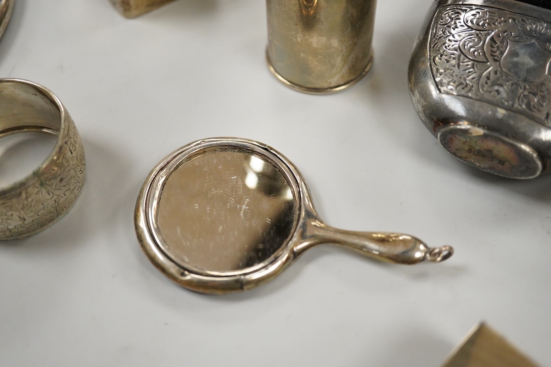 Sundry small silver, including two cigarette cases, a match sleeve holder, three napkin rings, two condiments, matchbox sleeve, shaving brush canister, commemorative small dish, a mounted hand mirror and mounted handbag